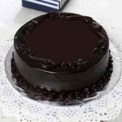 Dark Truffle Chocolate Cake with rich, velvety chocolate layers and a smooth truffle filling, elegantly presented for a luxurious dessert experience.