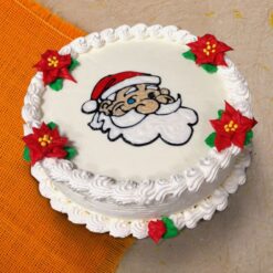 Fondant Santa Designer Cake featuring an adorable Santa Claus figure with detailed fondant decorations, perfect for festive celebrations and holiday parties.