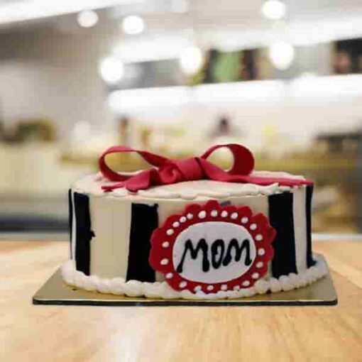 Elegant Designer Cake for Mom with custom decorations and intricate designs, perfect for celebrating Mother's Day or special occasions.