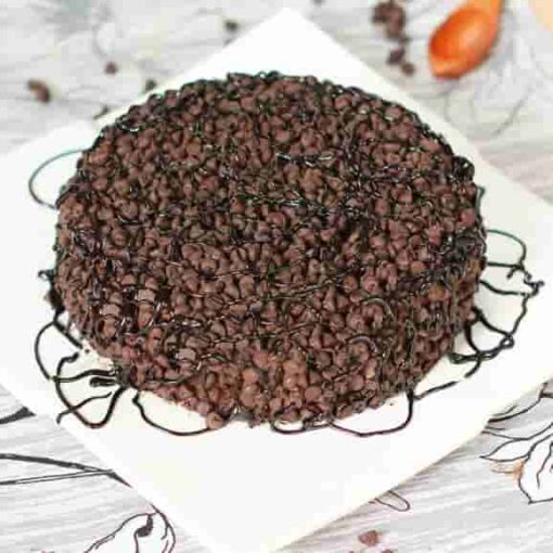 Decorated Choco Chips Cake with rich chocolate layers and topped with delicious choco chips, beautifully crafted for a delightful dessert experience.