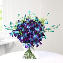 Glorious Blue Orchids Bouquet featuring a vibrant arrangement of blue orchids, ideal for a stunning and memorable gift on any occasion.