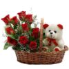 Red Roses with Cute Teddy in Basket: a charming gift set featuring fresh red roses and an adorable teddy bear arranged in a basket.