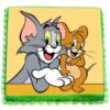 Tom & Jerry Cake with colorful decorations featuring the iconic cartoon characters Tom and Jerry, perfect for a fun and festive birthday party.