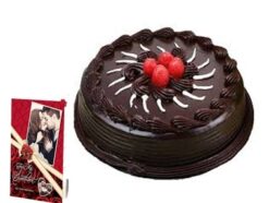 Chocolate Truffle Cake with a rich, glossy finish, accompanied by a personalized greeting card—ideal for celebrating special moments or sending heartfelt wishes.