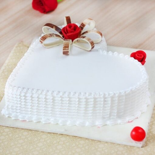 Delicious Heart Vanilla Cake with moist vanilla layers shaped into a heart and topped with creamy frosting, ideal for romantic and special celebrations.