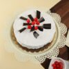 Vanilla and Black Forest Cake: A layered cake featuring a blend of creamy vanilla and rich Black Forest flavors, elegantly decorated.