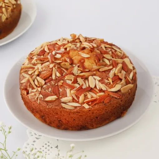 Almond Plum Cake showcasing a moist, flavorful cake with a delightful mix of almonds and plums, perfect for any special occasion.