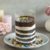 Chocolaty Gems Pullup Cake with rich chocolate layers and a pull-up design revealing hidden gems, perfect for a fun and indulgent celebration.