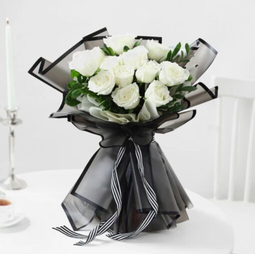 Enchanted Noir Rose Ensemble featuring elegant black roses arranged beautifully, creating a striking and luxurious floral display.