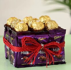 Ferrero Rocher & Dairy Milk featuring an assortment of Ferrero Rocher chocolates and Dairy Milk bars, ideal for a sweet gift.