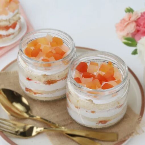 Fruit Fusion Quad Cake Jars featuring two layers of vibrant fruit-flavored cake in individual jars, ideal for a tasty dessert.