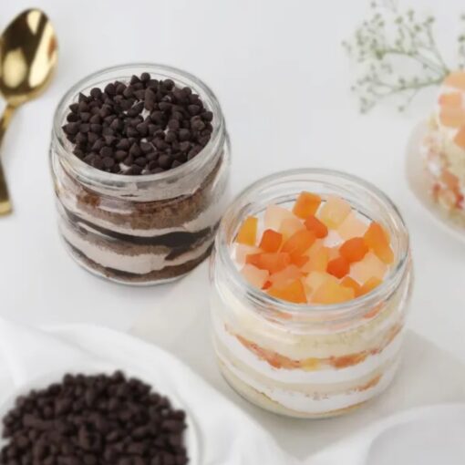 Fruitful Fusion Chocochip Cake Jar Duo featuring layers of rich chocochip cake combined with fruity flavors, presented in individual jars.