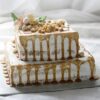 Golden Chocolate Tiered Delight cake with multiple rich chocolate layers, elegantly decorated with gold accents, ideal for special occasions.