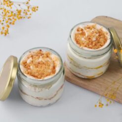 Quad cake jars featuring layers of golden cake and crunchy toppings, perfect for dessert lovers and ideal for gifting.