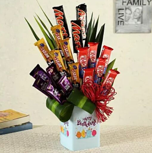 Happy Birthday Chocolate Vase featuring a vase filled with assorted chocolates and a festive birthday message, ideal for celebrations.