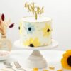 Mom's Blossom Bliss Cake – a stunning floral-themed cake designed to celebrate Mother's Day with vibrant colors and delicious flavors.