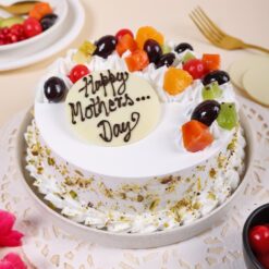 Mom's Heavenly Vanilla Fruit Cake featuring a light vanilla base topped with fresh fruits, ideal for a refreshing and elegant Mother's Day dessert.