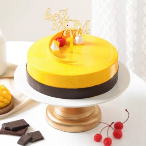 Mom's Mango Magic Cake showcasing vibrant mango layers and creamy frosting, a delightful dessert for Mother's Day or any special occasion.