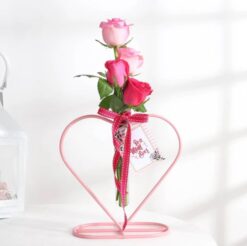 Beautiful roses in a heart-shaped planter, ideal for gifting Mom on special occasions, showcasing love and elegance.