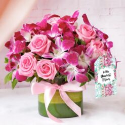 Elegant bouquet featuring orchids and roses, designed to celebrate Mom with a harmonious blend of sophisticated and classic blooms.