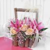 Beautiful wooden basket bouquet featuring fresh roses and lilies, perfect for gifting and adding elegance to any occasion.