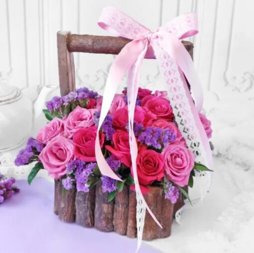 Charming basket filled with a medley of fresh roses, perfect for rustic-themed décor, gifting, or special occasions.