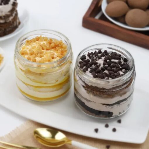 Scotch Chip Fusion Cake Jar Duo featuring layers of rich scotch-flavored cake with chocolate chips, presented in individual jars for a delightful treat.