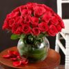 Opulent arrangement of red roses, showcasing a grand and elegant floral display ideal for special events and romantic moments.