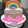 Chocolate cake adorned with colorful rainbow sprinkles, offering a fun and vibrant touch to a rich chocolate dessert.