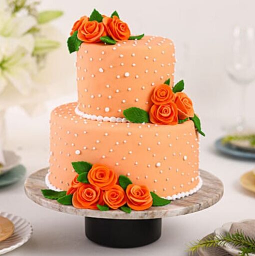 Multitier cake with peach rose decorations and elegant design, ideal for adding a touch of sophistication to special events.