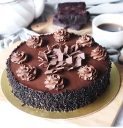 Truffle Delight Cake with layers of rich chocolate and creamy truffles, offering an indulgent and luxurious dessert experience.