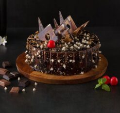 Marble Crunch Truffle Cake featuring a marble cake base with crunchy truffles, ideal for a rich and textured dessert.