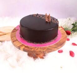 Smooth Chocolate Truffle Cake with a rich chocolate base and silky truffle filling, ideal for a luxurious and elegant dessert.