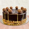 Ferrero Choco Truffle Cake featuring layers of rich chocolate cake and Ferrero Rocher truffles, ideal for a luxurious dessert.