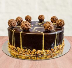 Ferrero Choco Truffle Cake featuring layers of rich chocolate cake and Ferrero Rocher truffles, ideal for a luxurious dessert.