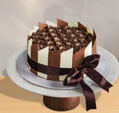 Delicious Yummy Chocolate Cake with rich chocolate layers and decadent frosting, ideal for a sweet and indulgent dessert experience.