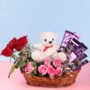 Roses and Teddy Arrangement Basket featuring vibrant red roses arranged with a plush teddy bear, ideal for heartfelt gifts and special occasions.