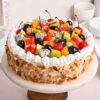 Fruit and Almond Vanilla Cake featuring a vanilla base topped with fresh fruit and almonds, ideal for festive occasions.