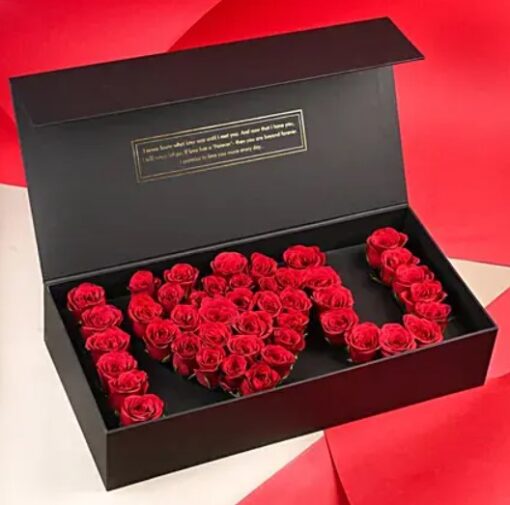 Love Arrangement Roses in Black Box featuring elegant red roses arranged in a sleek black box, ideal for romantic gifts and celebrations.