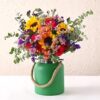 Adorable Mixed Flowers in Green Jar featuring a vibrant assortment of flowers arranged in a stylish green jar, ideal for gifts.