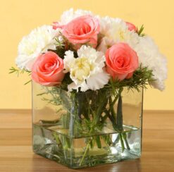 Pink Roses with White Carnations Vase featuring a lovely mix of pink roses and white carnations arranged in a chic vase.