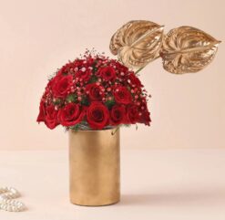 Red Roses & Anthuriums Cylindrical Vase featuring a sophisticated arrangement of red roses and anthuriums in a stylish cylindrical vase.