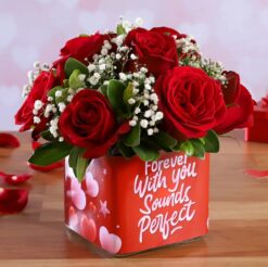 10 Red Roses Arrangement in Vase featuring a bouquet of 10 red roses arranged in a clear vase, ideal for romantic or special occasions.