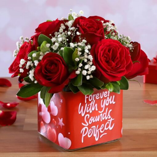 10 Red Roses Arrangement in Vase featuring a bouquet of 10 red roses arranged in a clear vase, ideal for romantic or special occasions.