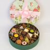 Floral Chocolate Box 21 Pcs featuring a beautifully decorated box with 21 assorted chocolates, perfect for a sophisticated and tasty gift.