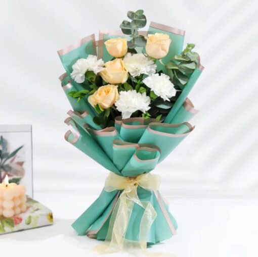 Serene Turquoise Haven floral arrangement featuring vibrant turquoise flowers and lush foliage, perfect for creating a peaceful and calming atmosphere.