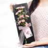 Elegant bouquet of carnations arranged in a slate design, perfect for expressing love and admiration for Mom on her special day.