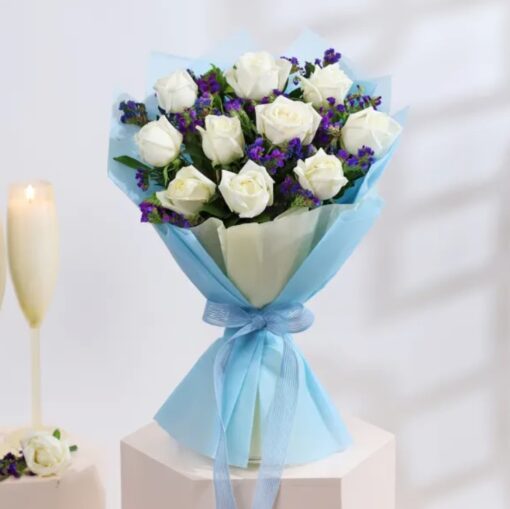 Beautiful bouquet of white roses arranged elegantly, perfect for weddings, anniversaries, or special occasions to convey purity and sophistication.