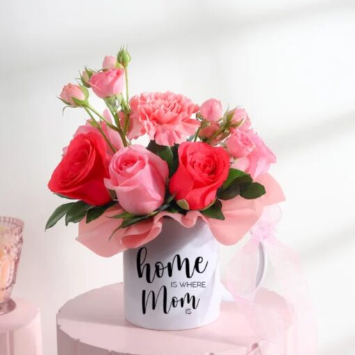 Charming mug filled with a vibrant spring bouquet, featuring fresh flowers designed to celebrate Mom and brighten her special day.