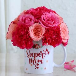 Charming mug filled with vibrant flowers, designed as a special gift for Super Mom, perfect for celebrating her with a thoughtful floral arrangement.